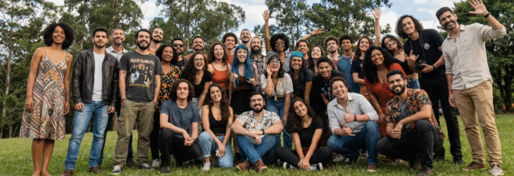 This is an image of a group of people gathered outdoors to have a group picture. It looks a lot like the community Sendium wants to build.